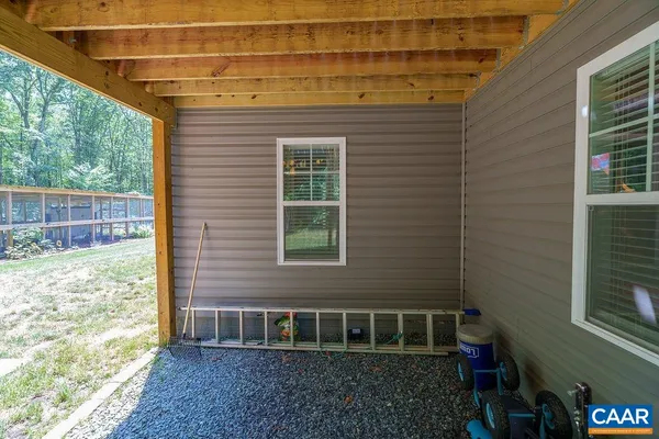 a view of a house with backyard and swimming pool