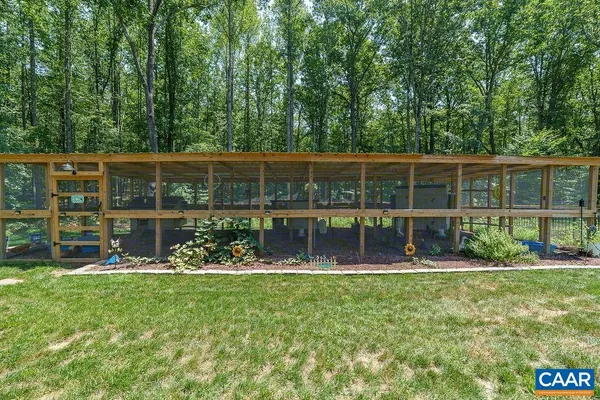 an aerial view of a house with yard swimming pool and outdoor seating