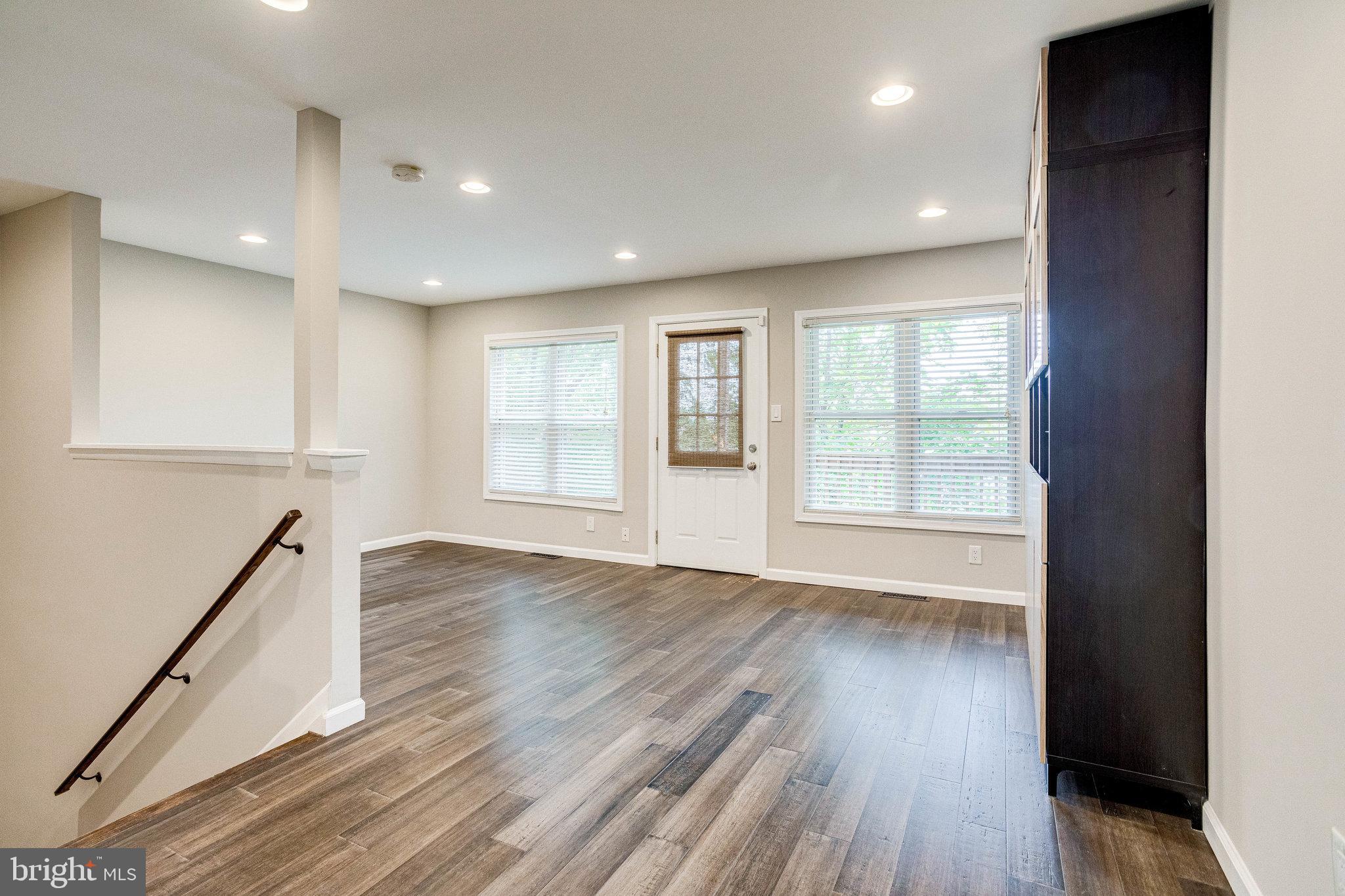 2648 Bowen Road Southeast Washington, DC 20020 - Photo 7 of 36 an empty room with wooden floor and windows