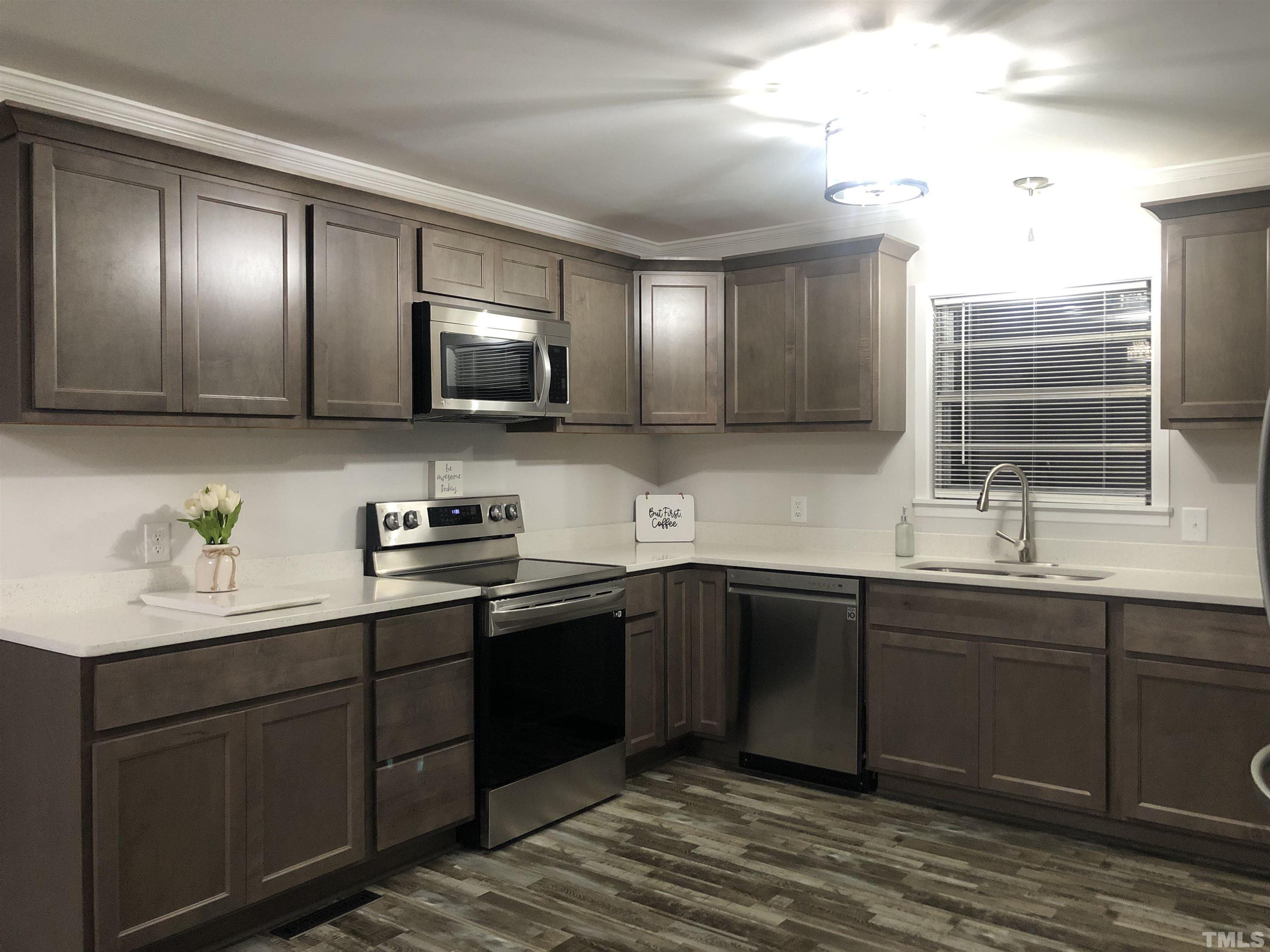 150 Community Drive Goldsboro, NC 27530 - Photo 13 of 30 a kitchen with a sink and cabinets