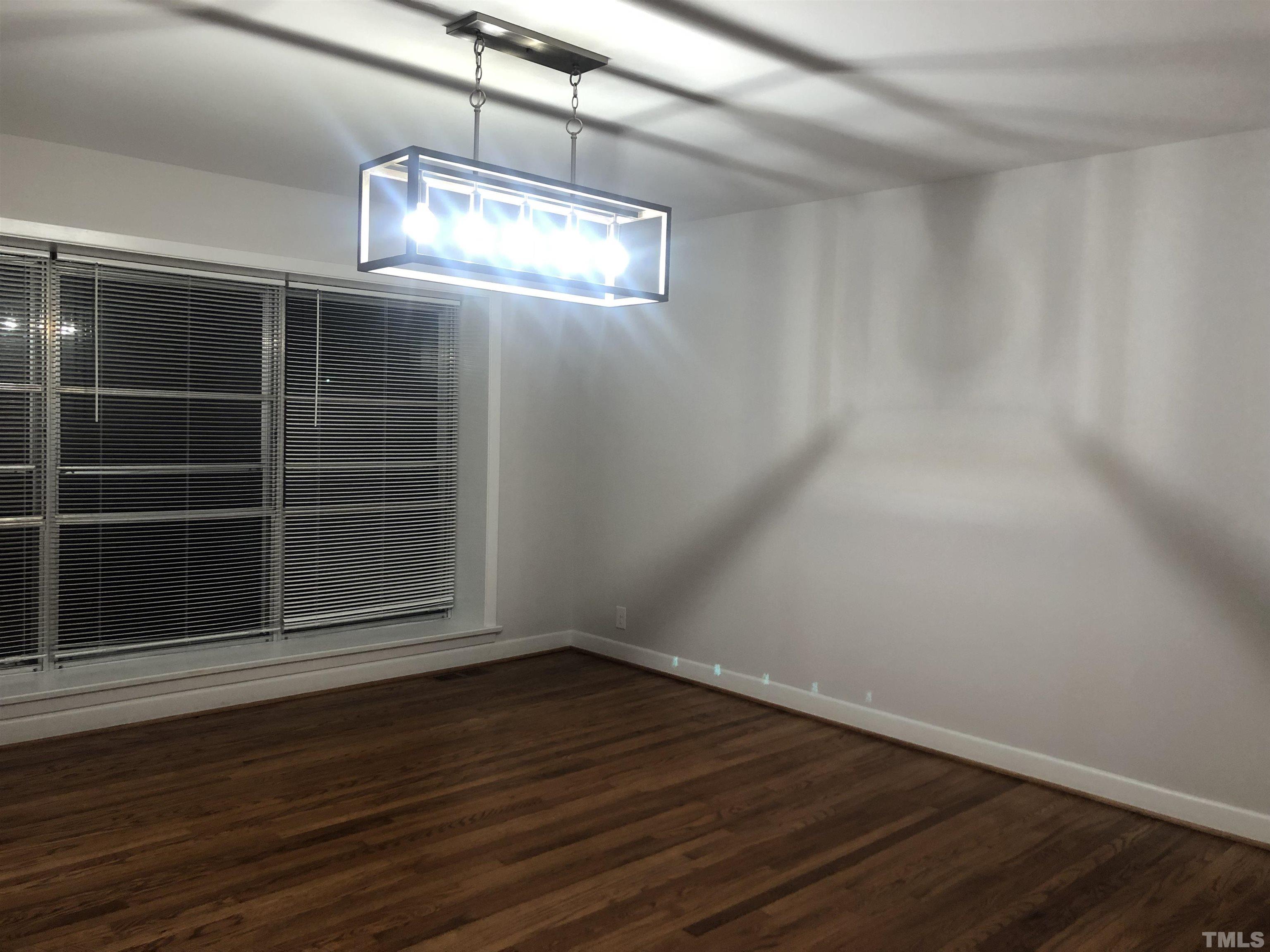 150 Community Drive Goldsboro, NC 27530 - Photo 19 of 30 a view of empty room with wooden floor and fan
