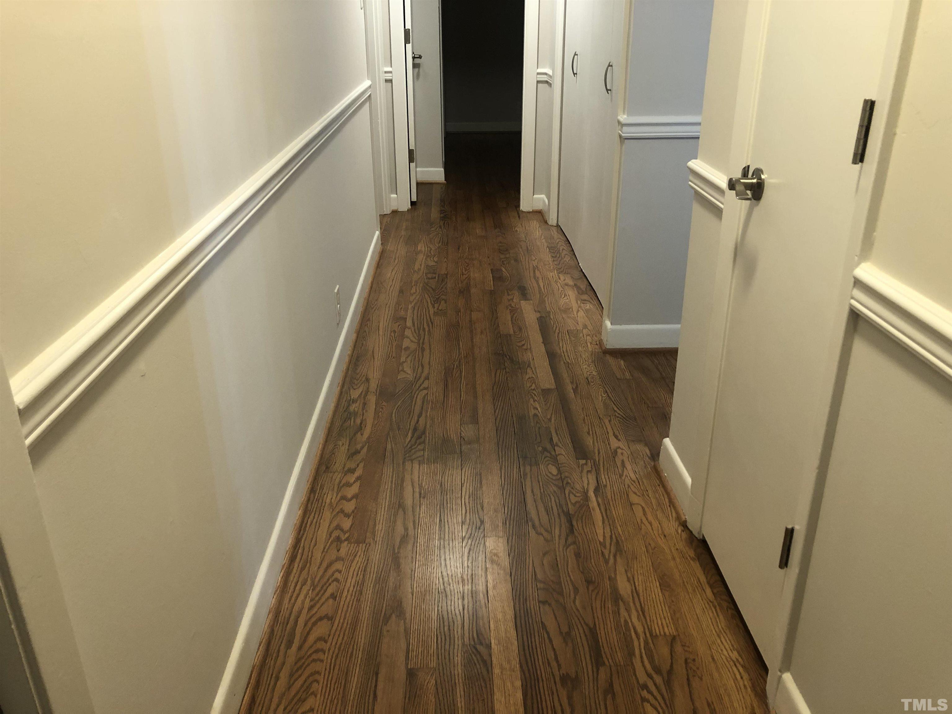 150 Community Drive Goldsboro, NC 27530 - Photo 21 of 30 a view of a hallway with wooden floor and staircase