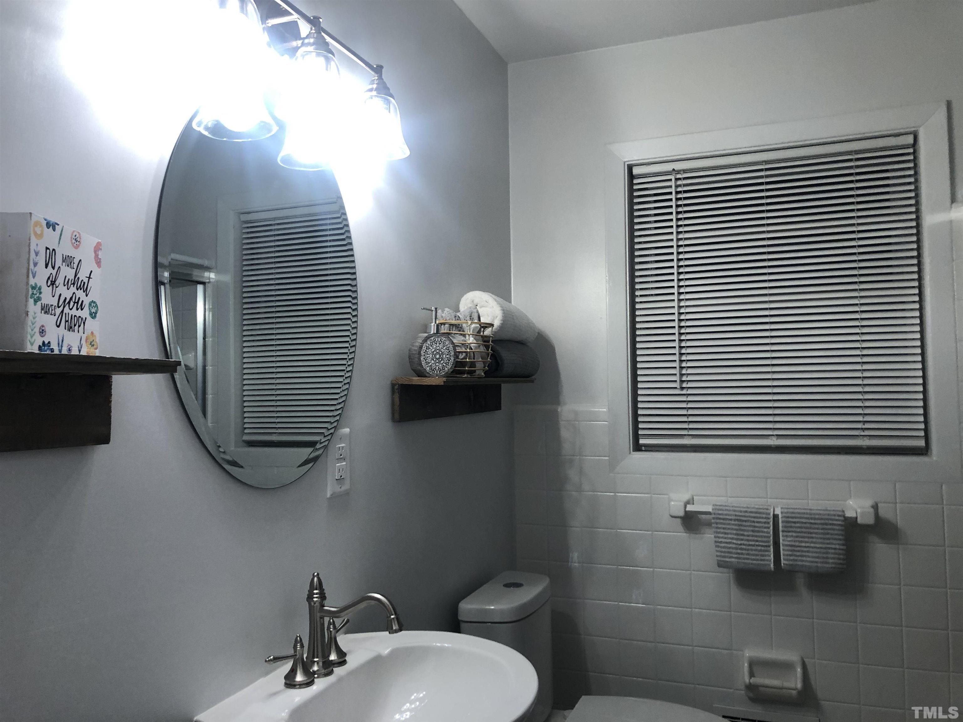 150 Community Drive Goldsboro, NC 27530 - Photo 22 of 30 a bathroom with a toilet and a sink