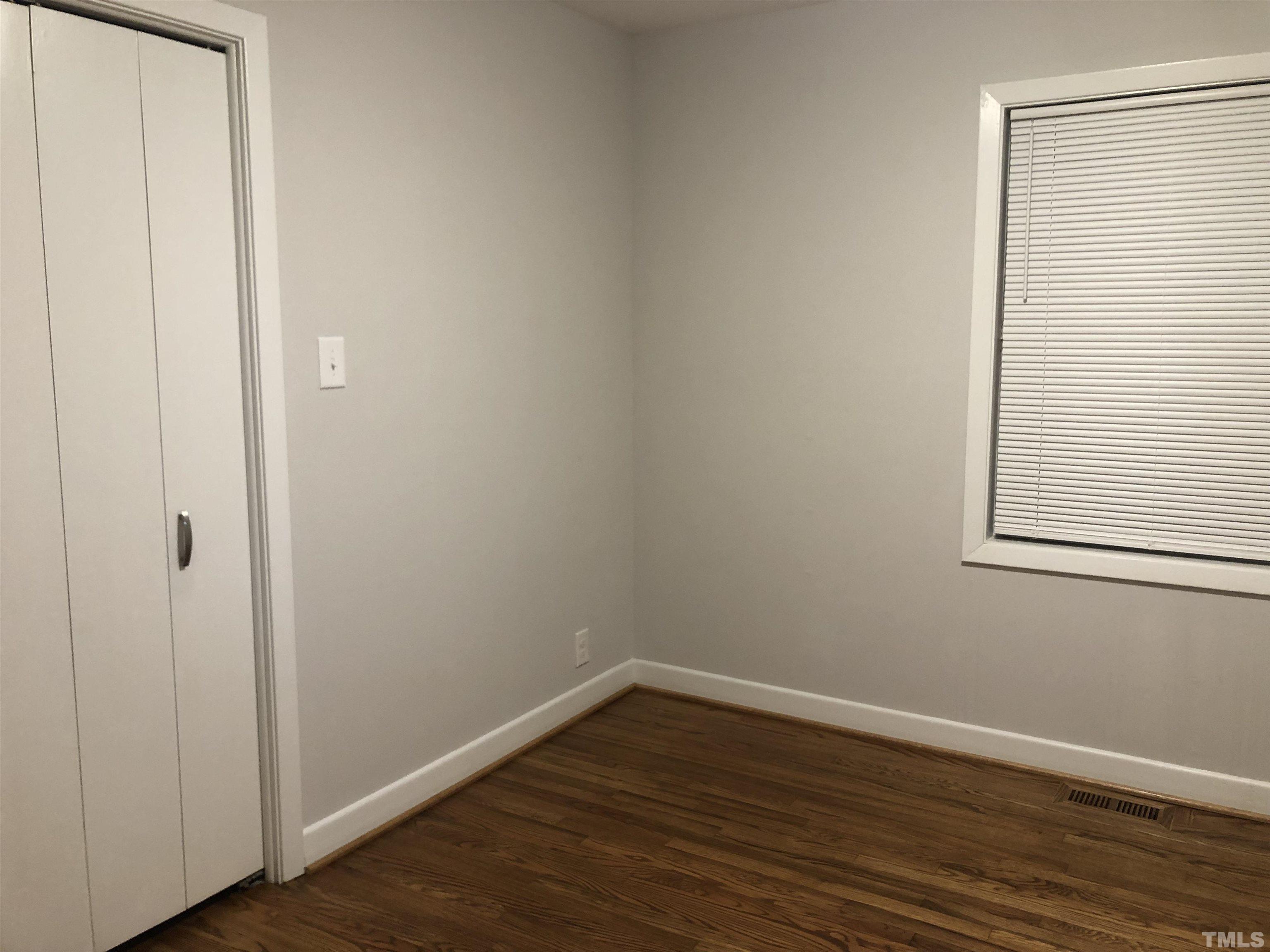 150 Community Drive Goldsboro, NC 27530 - Photo 25 of 30 a view of a small space with wooden floor and a window