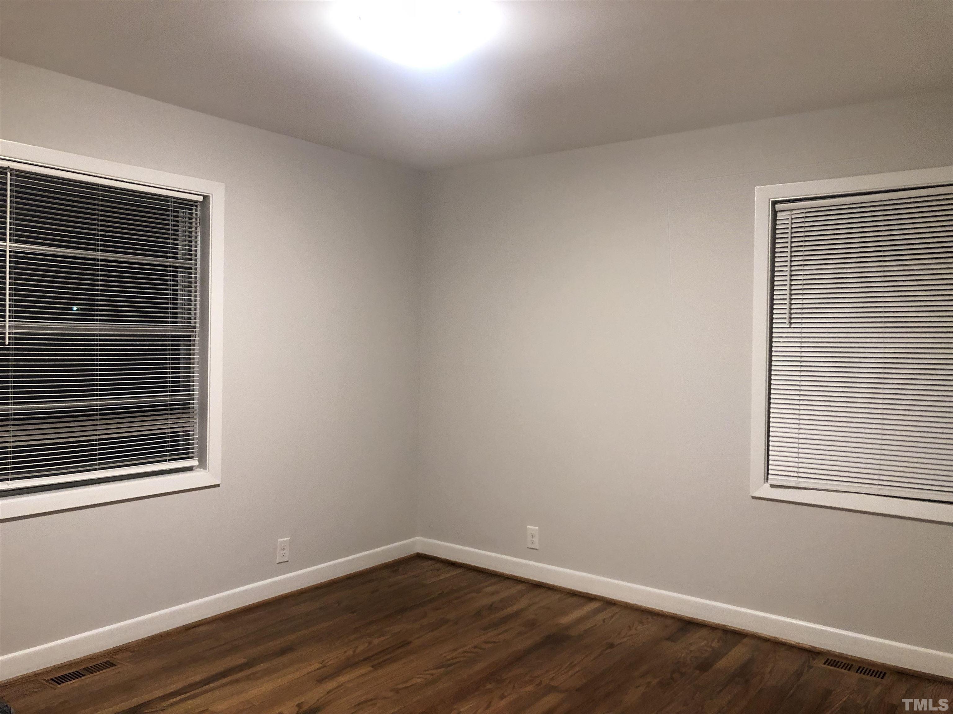 150 Community Drive Goldsboro, NC 27530 - Photo 27 of 30 a view of a room that has wooden floor and a window