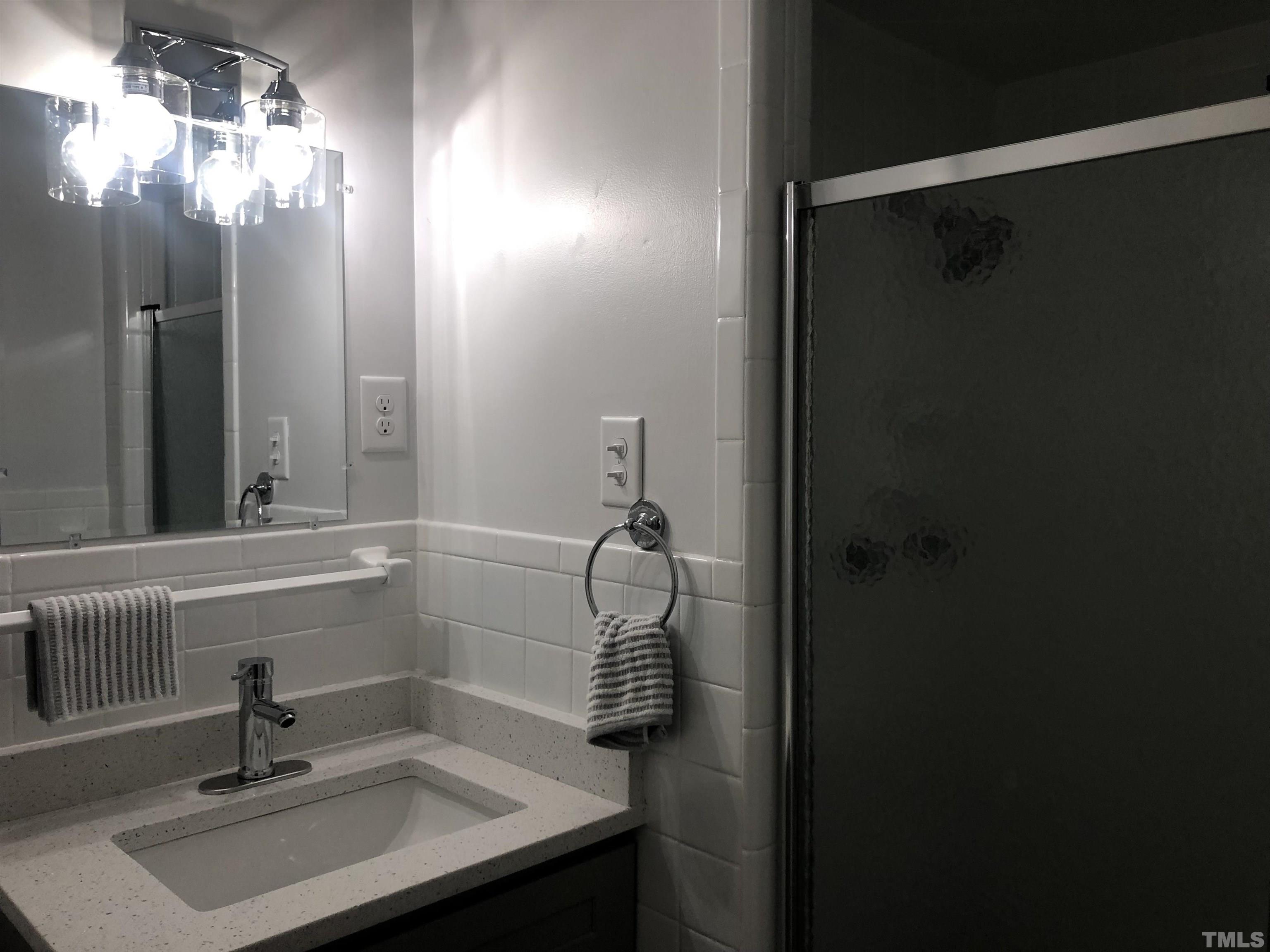 150 Community Drive Goldsboro, NC 27530 - Photo 29 of 30 a bathroom with a sink and mirror