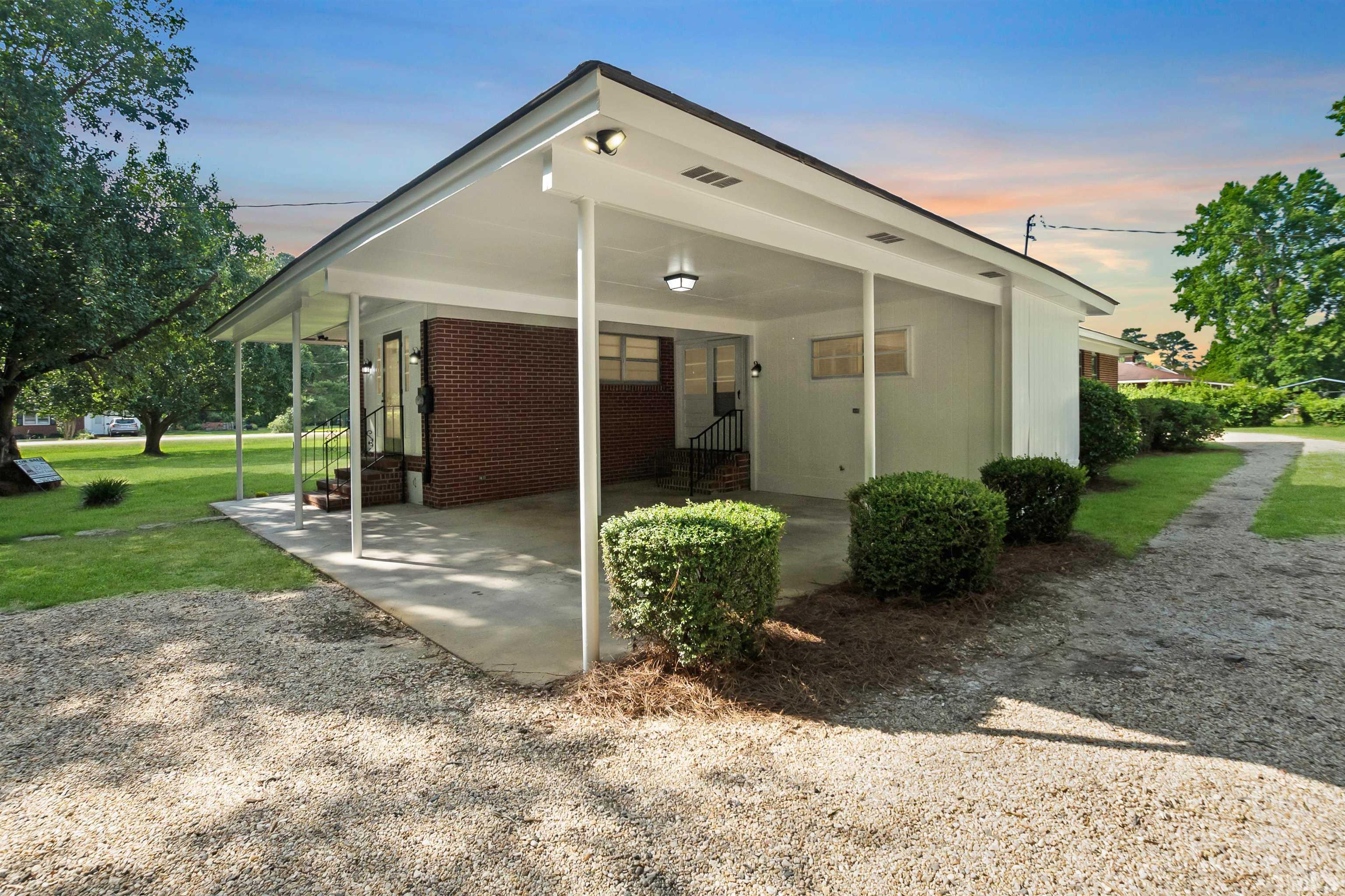 150 Community Drive Goldsboro, NC 27530 - Photo 3 of 30 a view of a house with backyard and garden