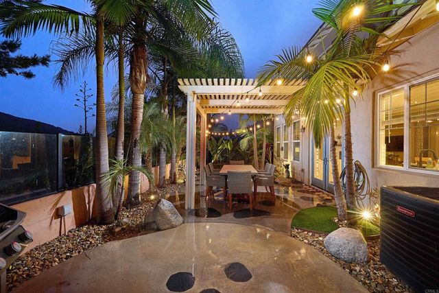 a view of a lobby with furniture and palm tree