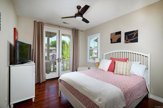a view of a house with a street from a balcony