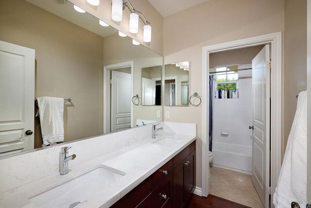 a bedroom with bed and a window