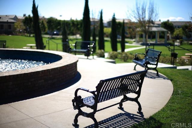 a view of a golf course with a fountain