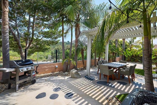 a view of a patio with wooden floor