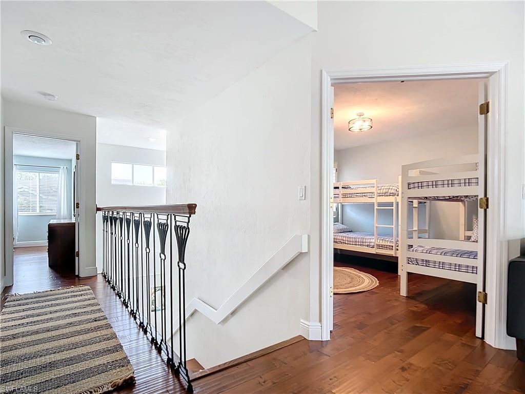 2860 Citrus Lake Drive, Unit R202 Naples, FL 34109 - Photo 23 of 50 a view of a hallway with seating area