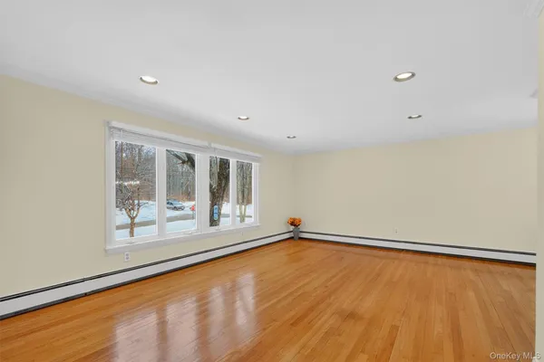 a view of an empty room with a window