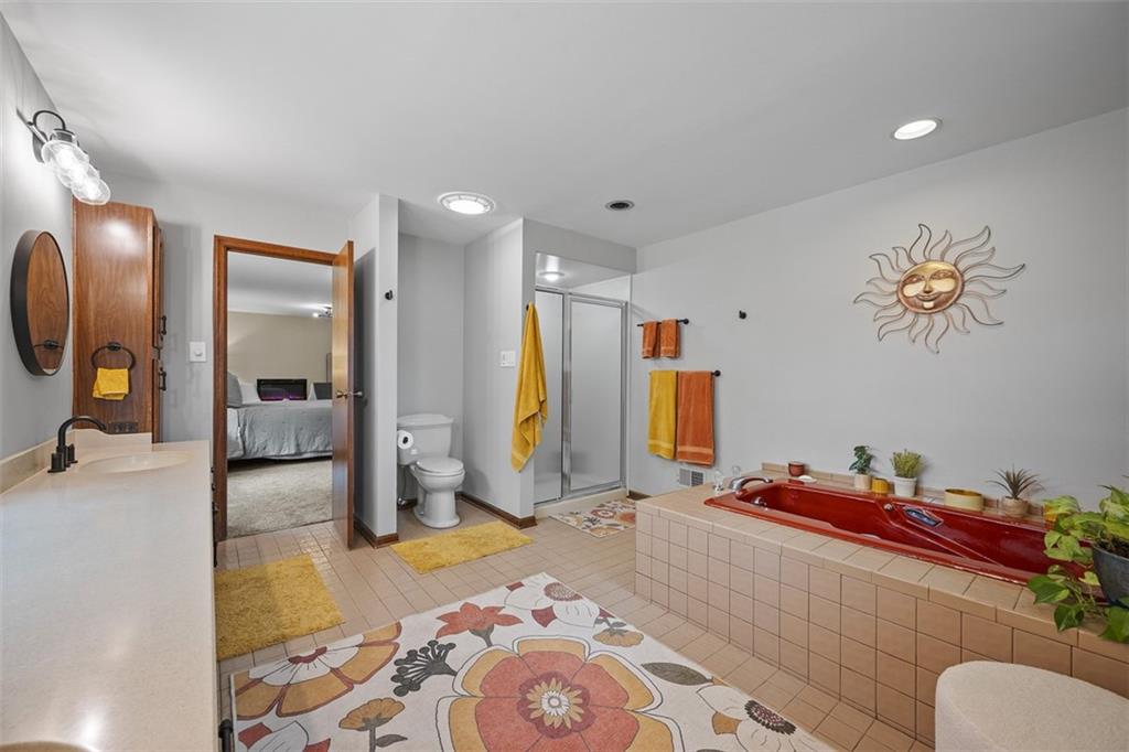 1000 Pleasant Hill Road Wexford, PA 15090 - Photo 16 of 37 a bedroom with a bed and wooden floor