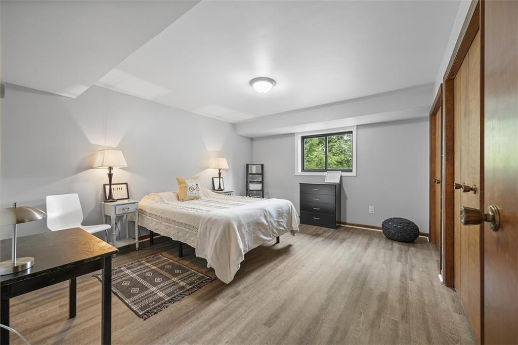 1000 Pleasant Hill Road Wexford, PA 15090 - Photo 19 of 37 a bedroom with a bed and wooden floor