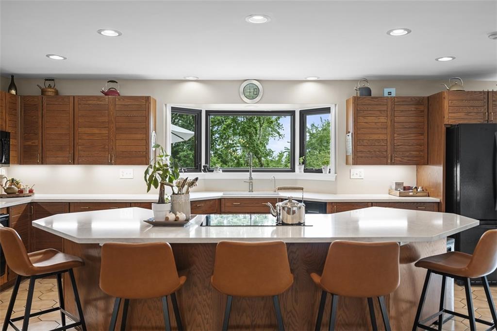 1000 Pleasant Hill Road Wexford, PA 15090 - Photo 3 of 37 a dining room with stainless steel appliances granite countertop a dining table chairs and window