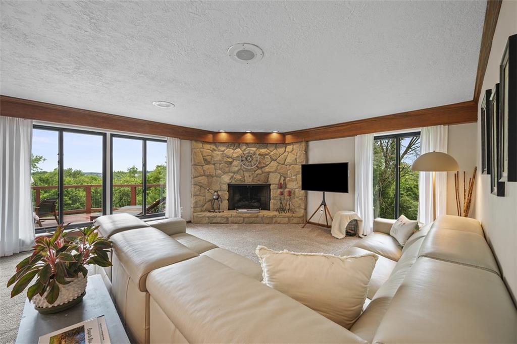 1000 Pleasant Hill Road Wexford, PA 15090 - Photo 8 of 37 a living room with furniture large windows and a flat screen tv
