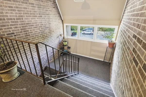 a view of balcony with wooden floor and windows