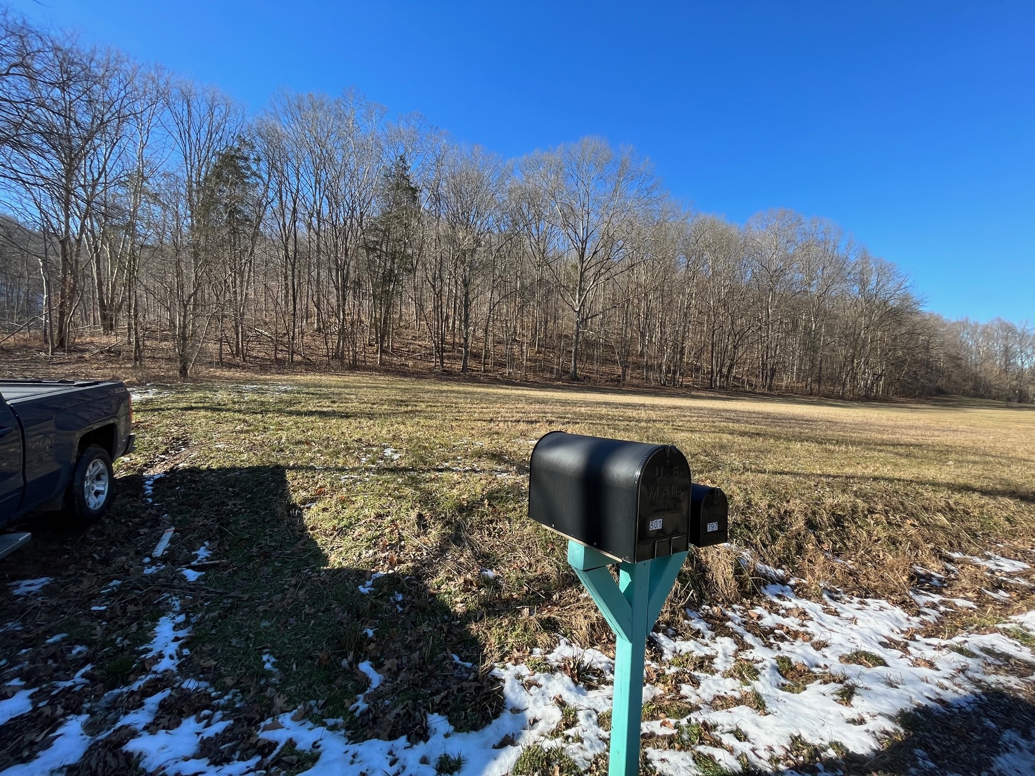 0 Wolf Hill Road Bethpage, TN 37022 - Photo 4 of 7 a view of a lake with a house in the background