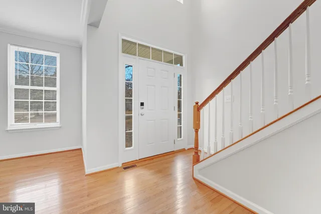 a view of an entryway with wooden floor