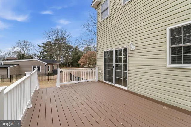 a view of a house with wooden deck