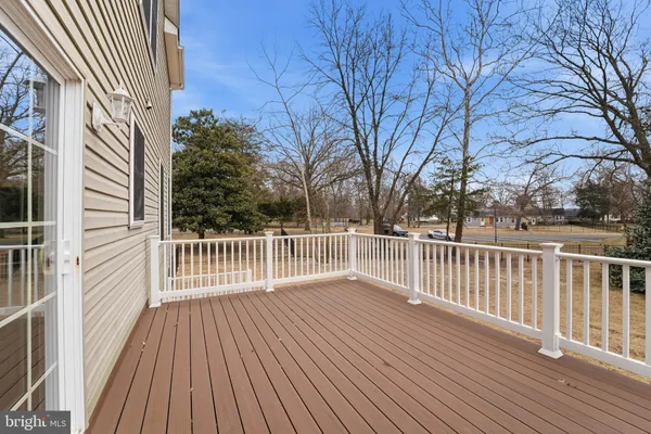 a view of a terrace with wooden floor and lake view