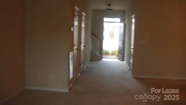 a view of hallway with closet