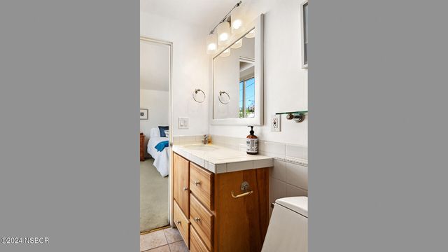 a utility room with sink dryer and washer