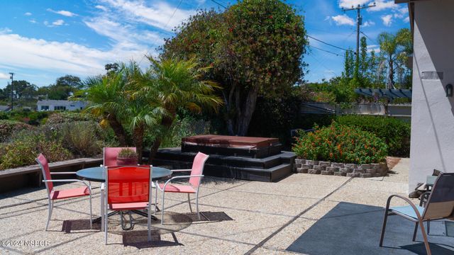 a view of a yard with furniture