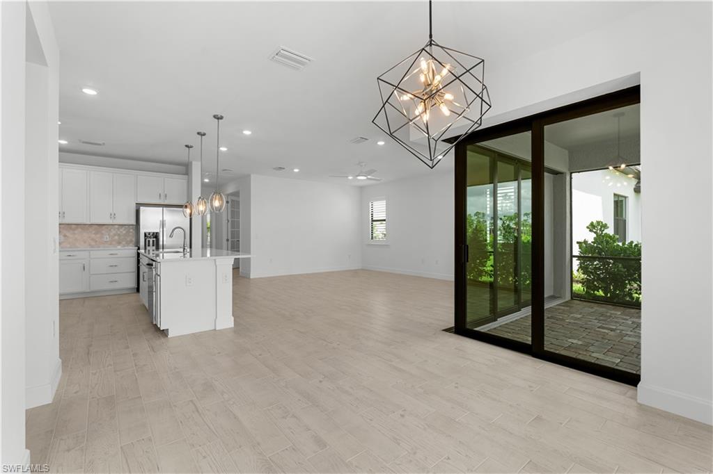 2104 Freemont Way Naples, FL 34119 - Photo 5 of 27 Zero pocket doors leading to lnai