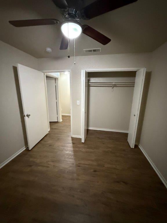 1405 East Cypress Avenue Reedley, CA 93654 - Photo 10 of 29 an empty room with wooden floor and natural light