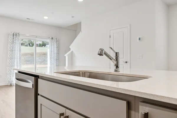 a kitchen with a sink and a window