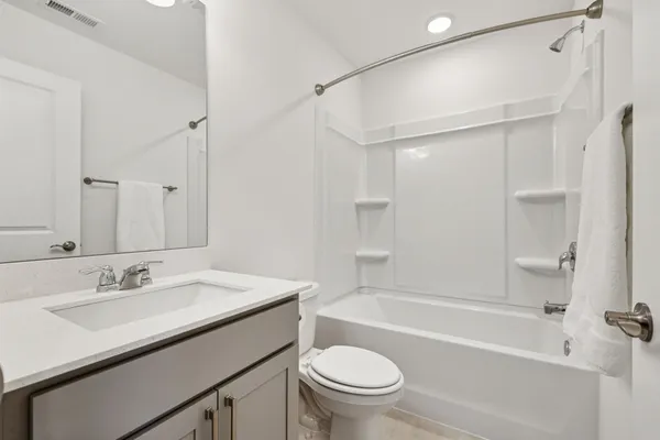 a bathroom with a sink a toilet and a bathtub