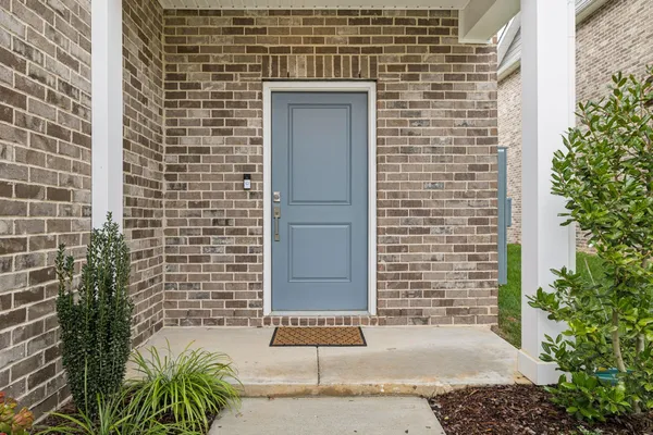 a view of a door and a window
