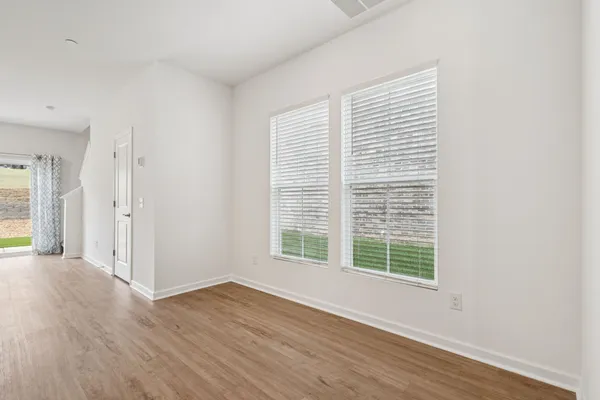 a view of a livingroom with wooden floor