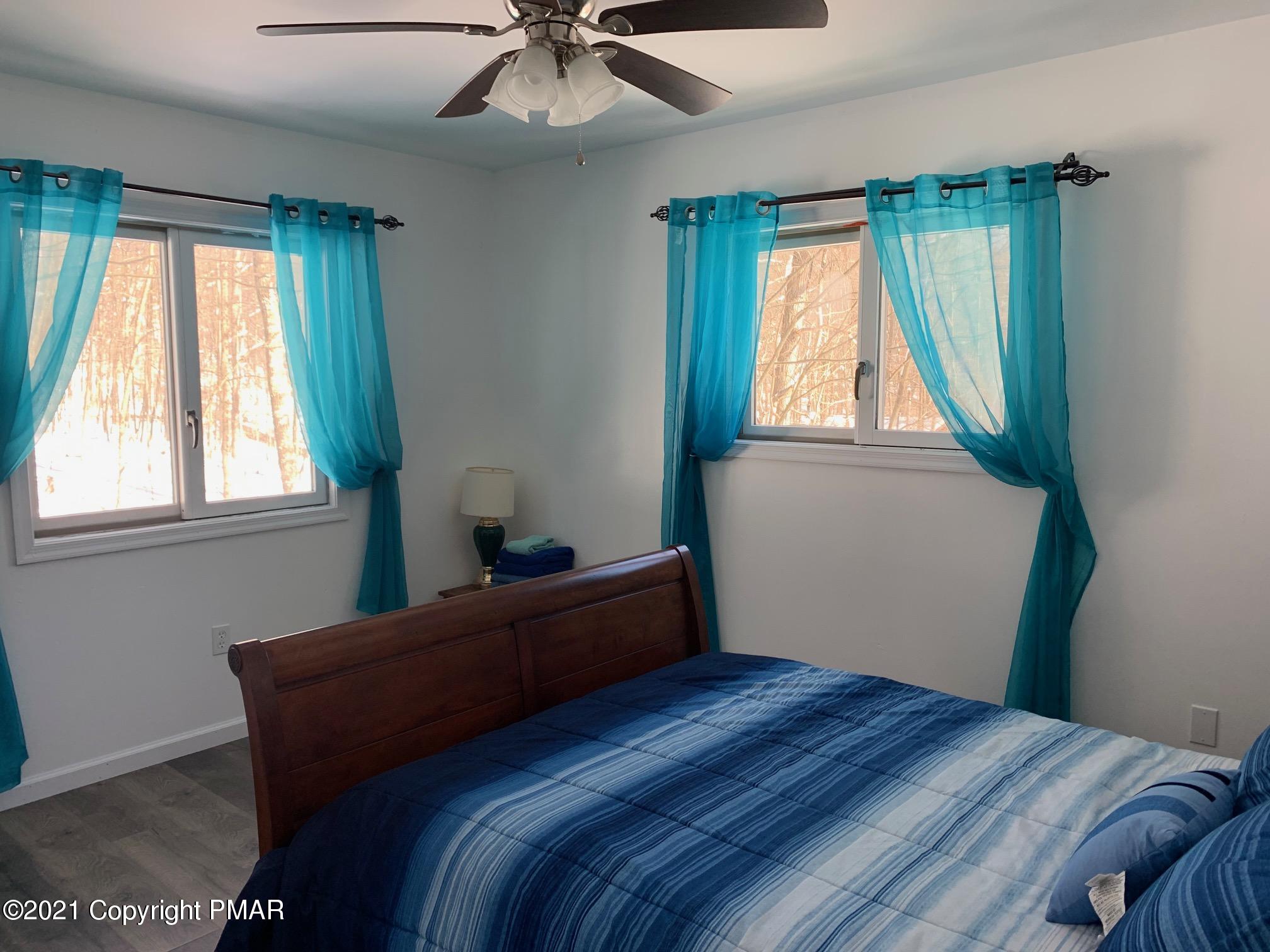 303 Otter Court Bushkill, PA 18324 - Photo 14 of 23 a bedroom with a bed and window