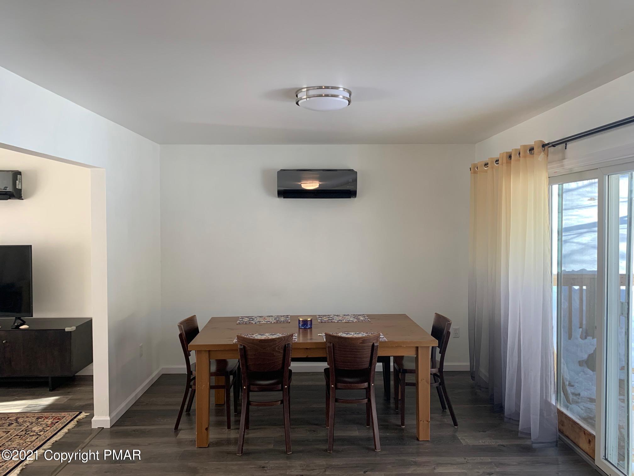 303 Otter Court Bushkill, PA 18324 - Photo 8 of 23 a view of a dining room with furniture