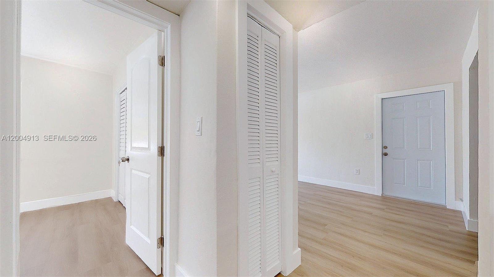 567 Southwest 3rd Street, Unit 2 Miami, FL 33130 - Photo 13 of 29 a view of a hallway with wooden floor