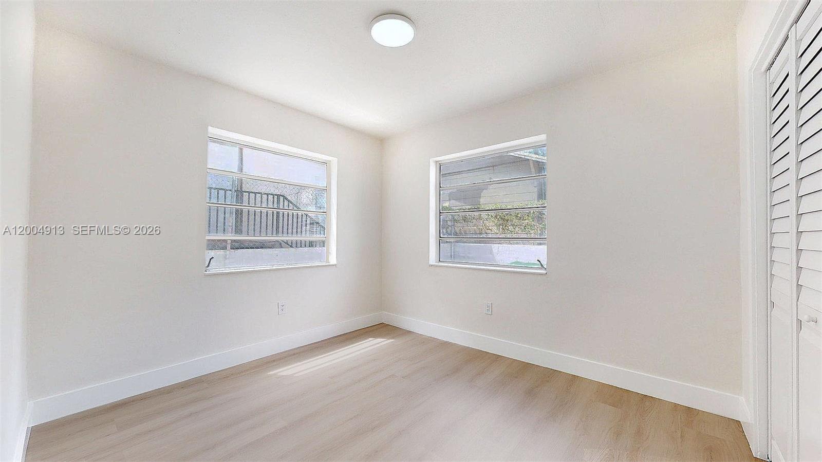 567 Southwest 3rd Street, Unit 2 Miami, FL 33130 - Photo 14 of 29 an empty room with windows