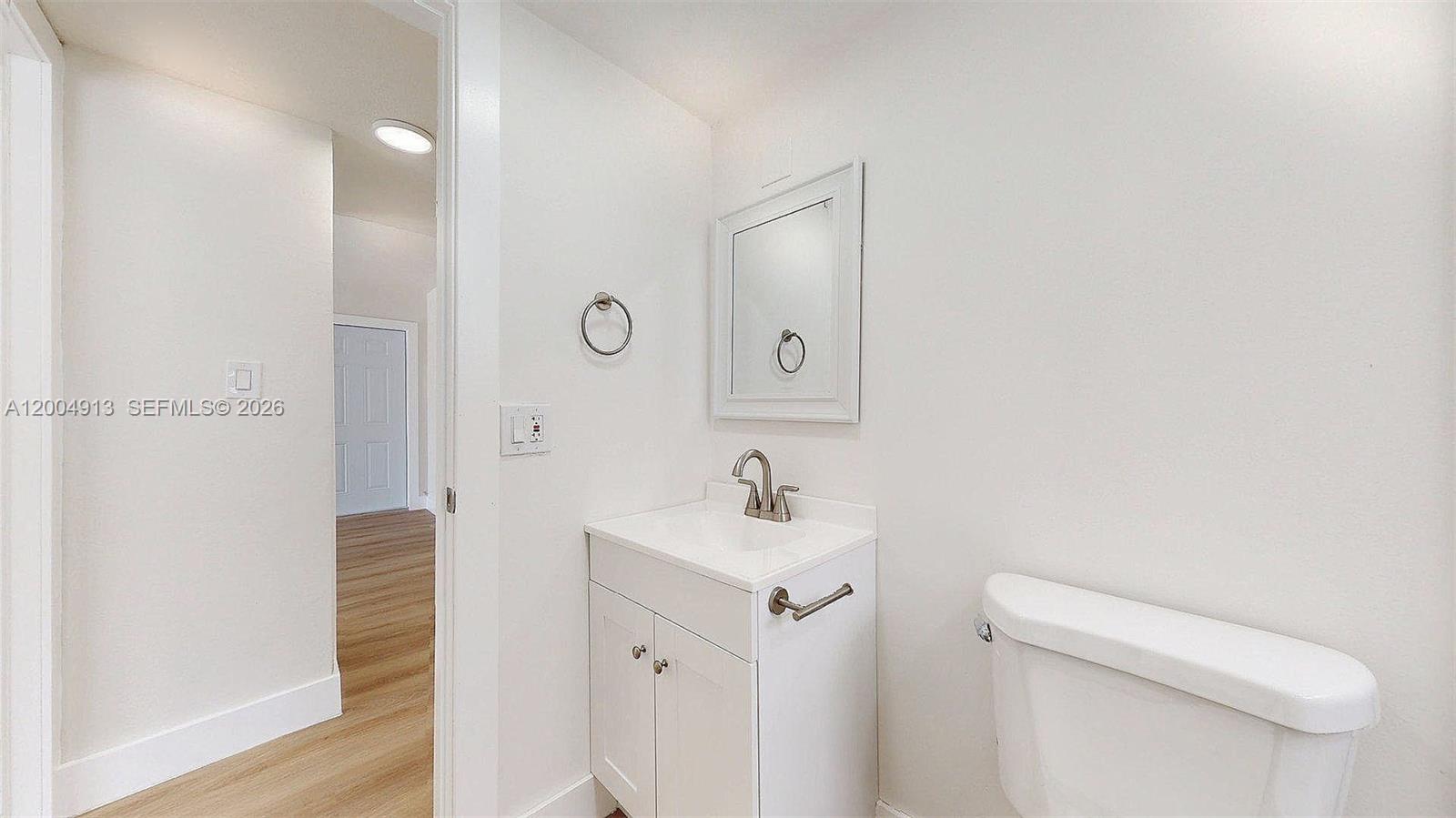 567 Southwest 3rd Street, Unit 2 Miami, FL 33130 - Photo 18 of 29 a bathroom with a sink a toilet and shower