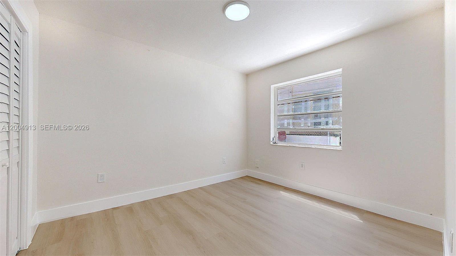 567 Southwest 3rd Street, Unit 2 Miami, FL 33130 - Photo 21 of 29 an empty room with a window