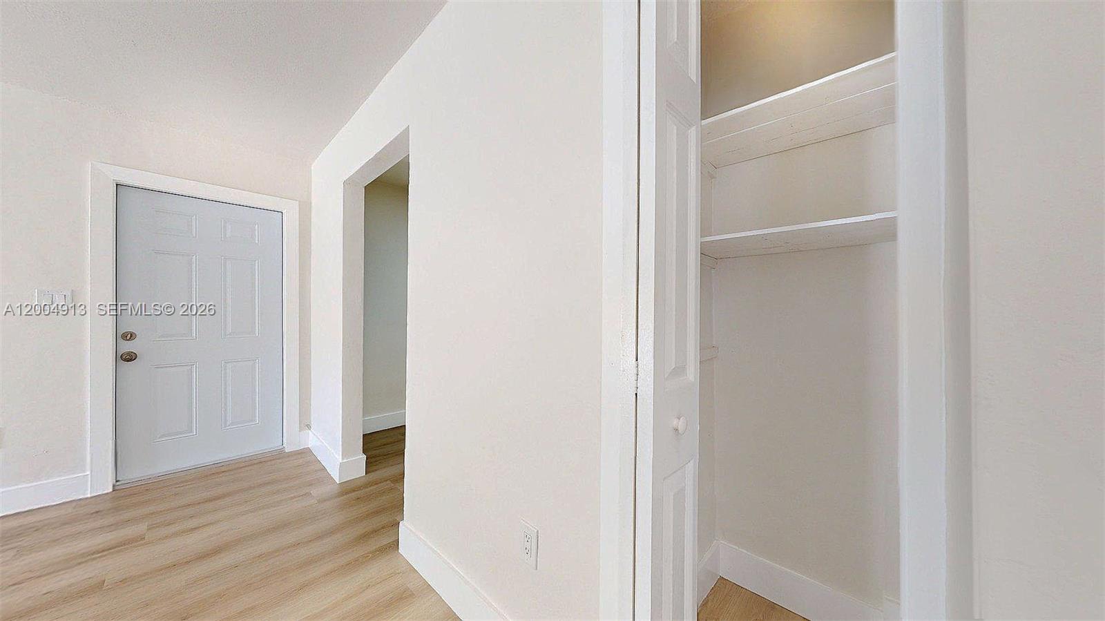 567 Southwest 3rd Street, Unit 2 Miami, FL 33130 - Photo 22 of 29 a view of a hallway with wooden floor