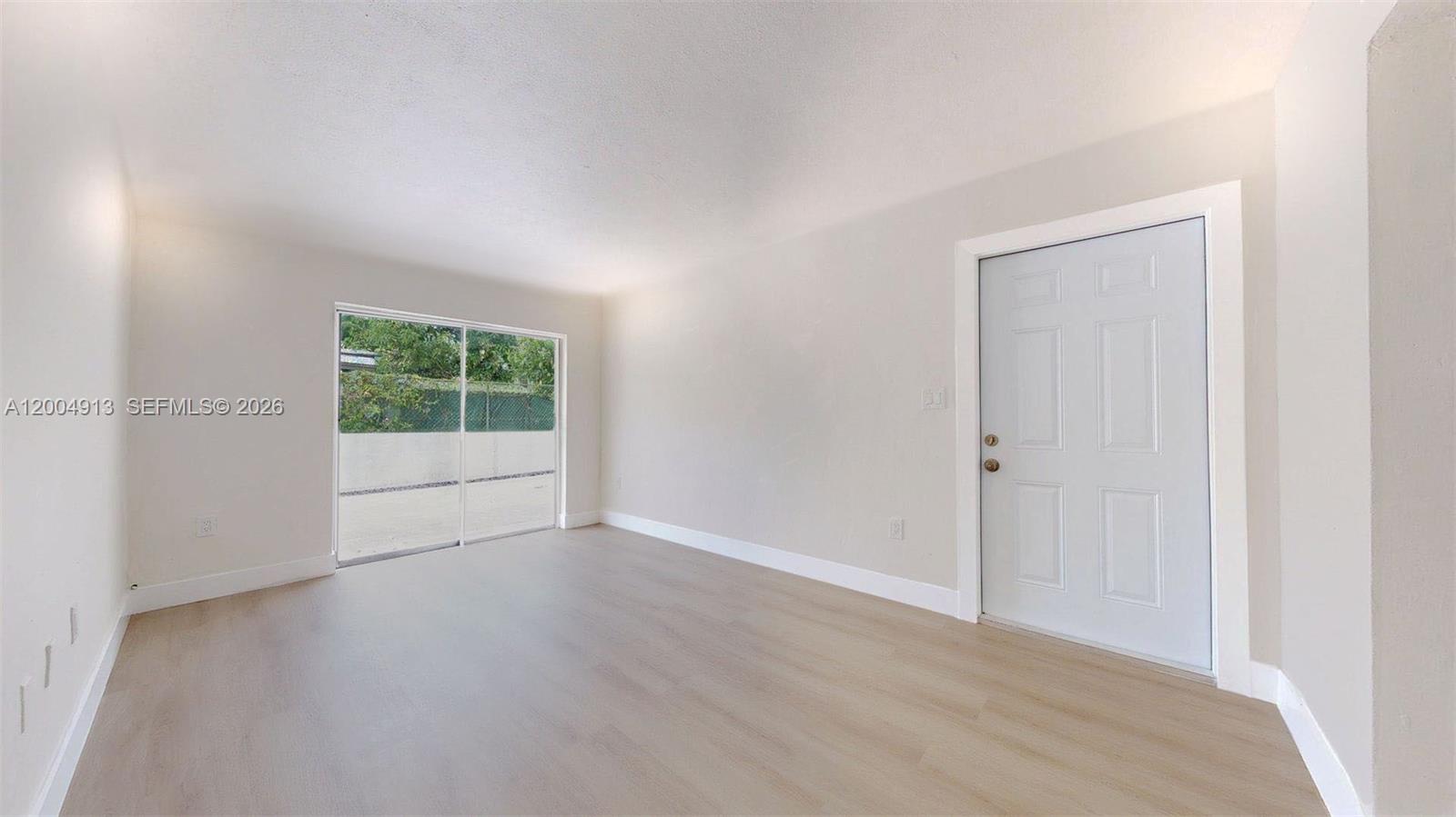 567 Southwest 3rd Street, Unit 2 Miami, FL 33130 - Photo 4 of 29 a view of an empty room with a window