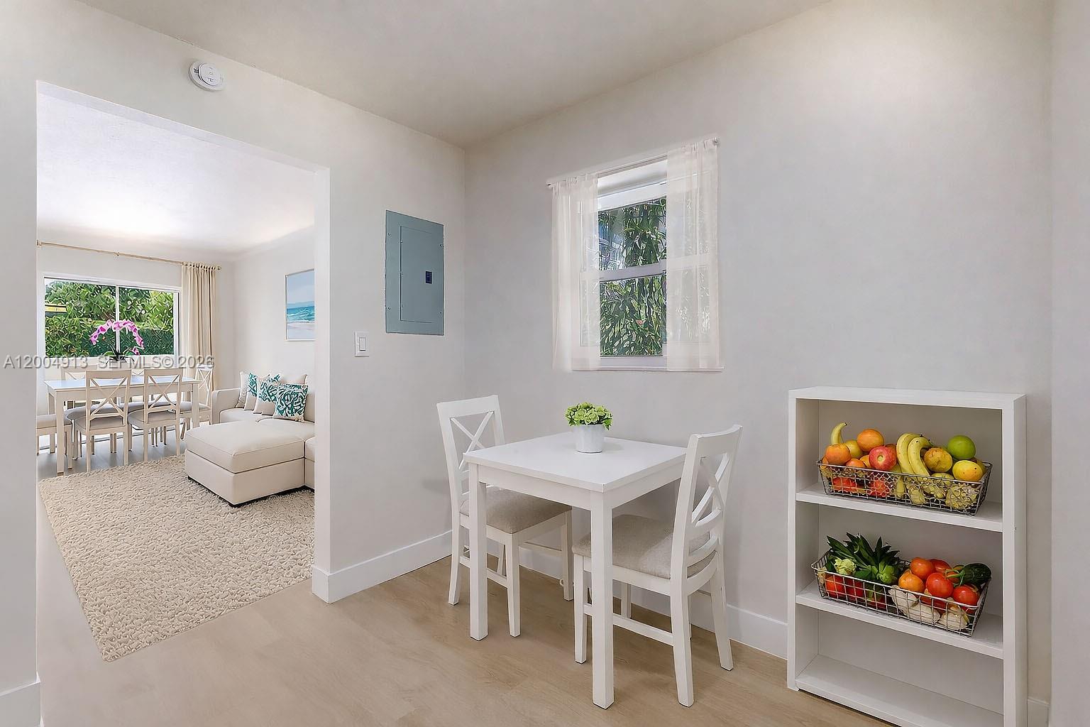 567 Southwest 3rd Street, Unit 2 Miami, FL 33130 - Photo 10 of 29 a dining room with furniture a book and window