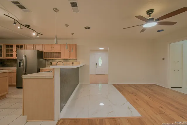 a kitchen with a stove sink and refrigerator