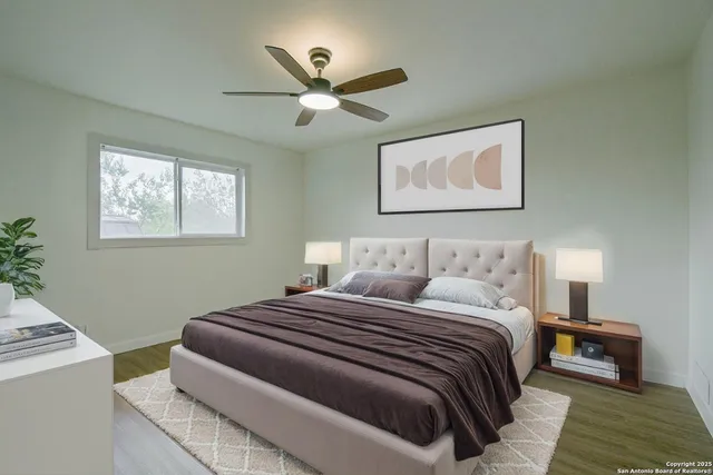 a bedroom with bed and window