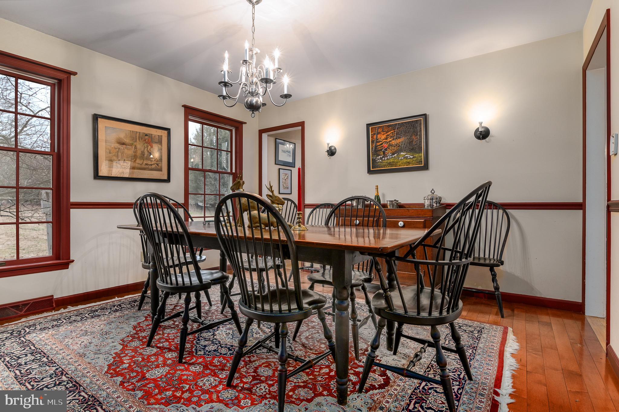 12 Phillips Lane Chester Springs, PA 19425 - Photo 22 of 54 a view of a dining room with furniture wooden floor and chandelier
