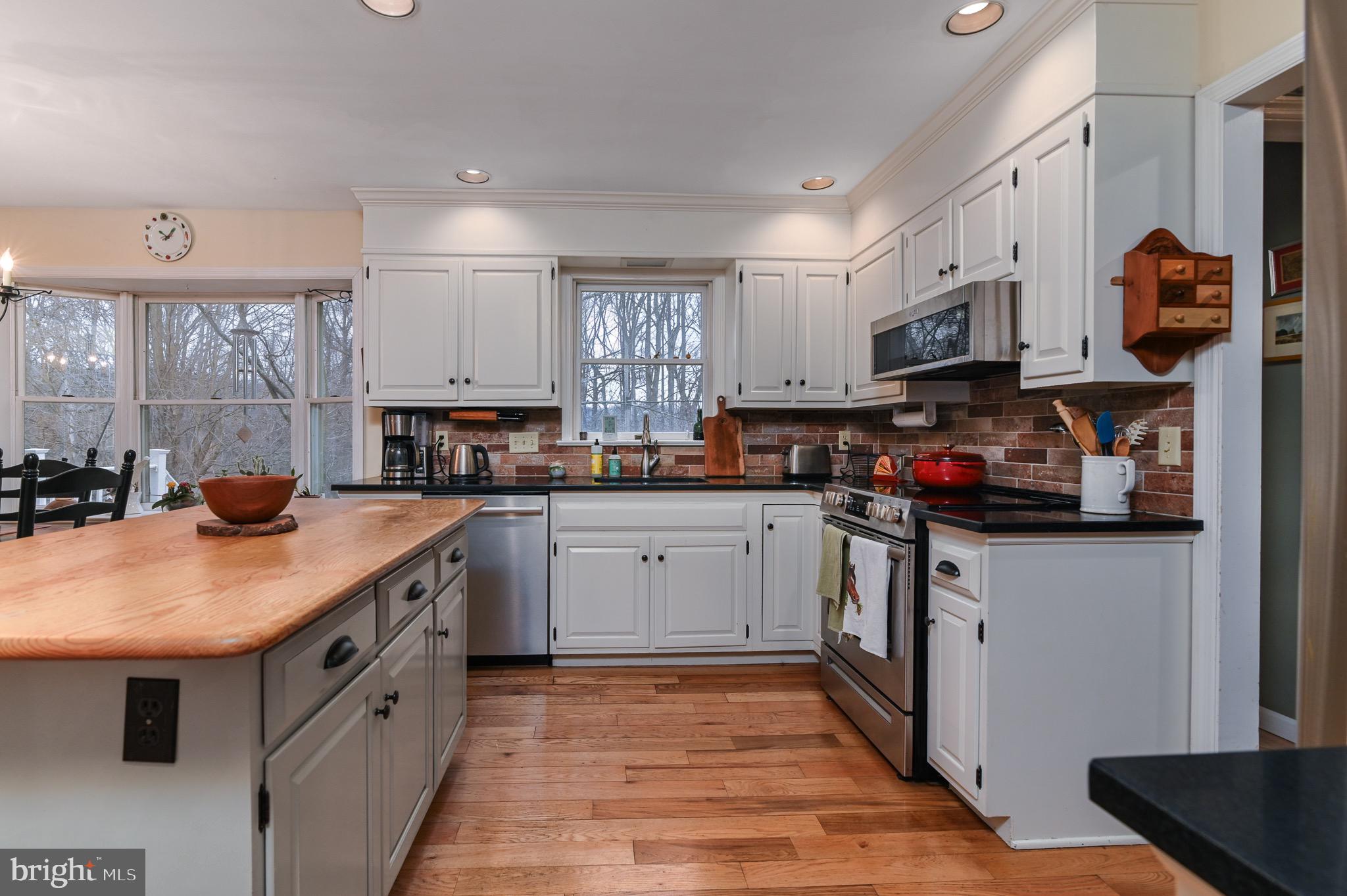 12 Phillips Lane Chester Springs, PA 19425 - Photo 24 of 54 a kitchen with stainless steel appliances granite countertop a sink stove and refrigerator