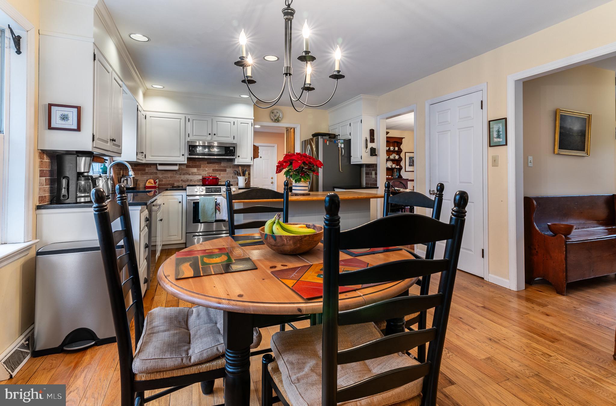 12 Phillips Lane Chester Springs, PA 19425 - Photo 26 of 54 a view of a dining room with furniture and wooden floor